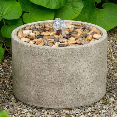 Salinas Pebble Fountain on gravel in the backyard