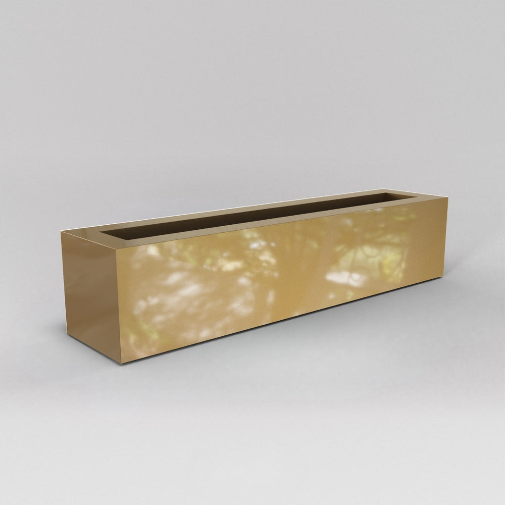 Salon Narrow Rectangle Fiberglass Planter in gloss metallic gold against gray background. 