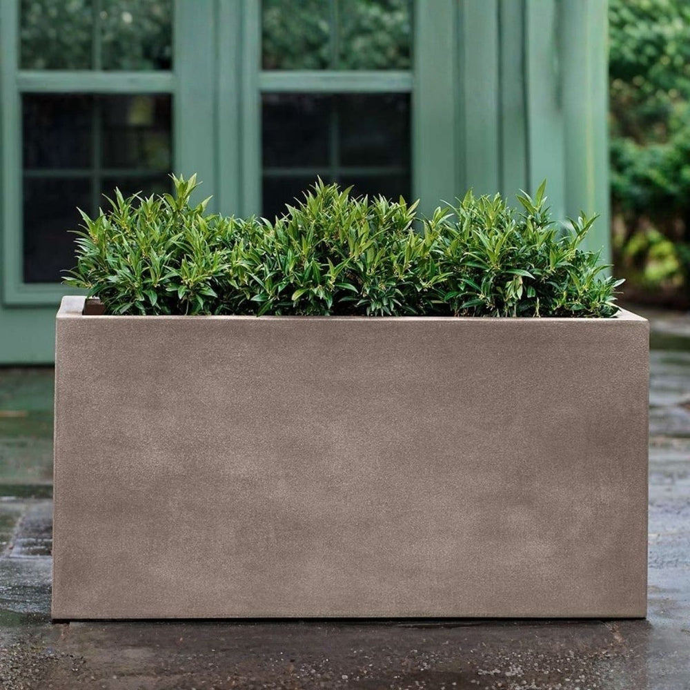Sandal Planter 482424 S/1 in riverstone premium lite on concrete in the backyard.