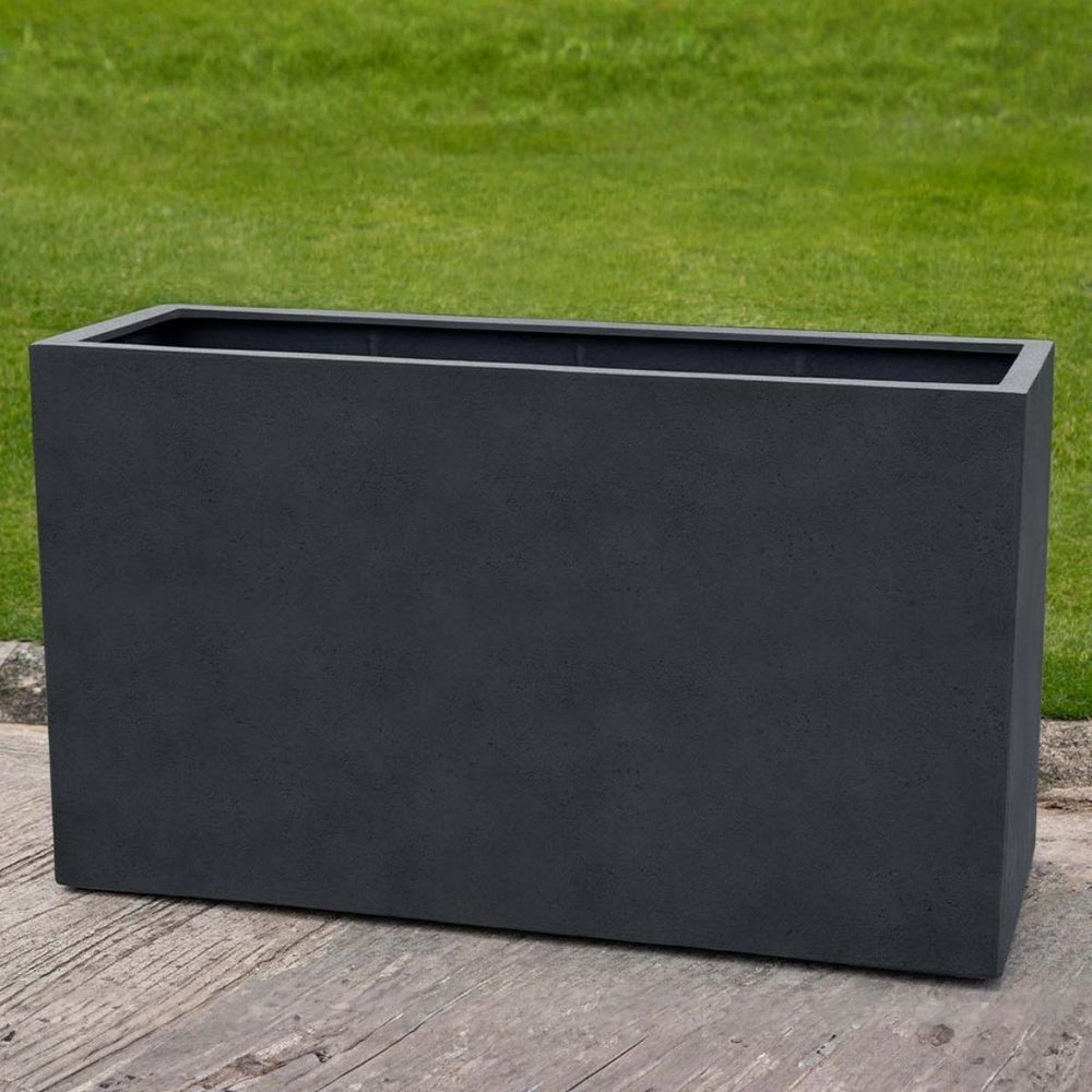 Sandal Planter 591836 S/1 in lead lite on concrete in the backyard.