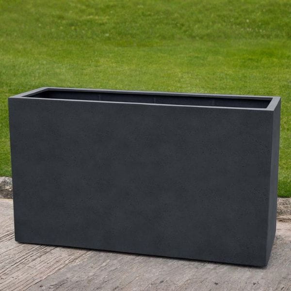 Sandal Planter 591836 S/1 in lead lite on concrete in the backyard.