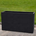 Sandal Planter 591836 S/1 in onyx black lite on concrete in the backyard.