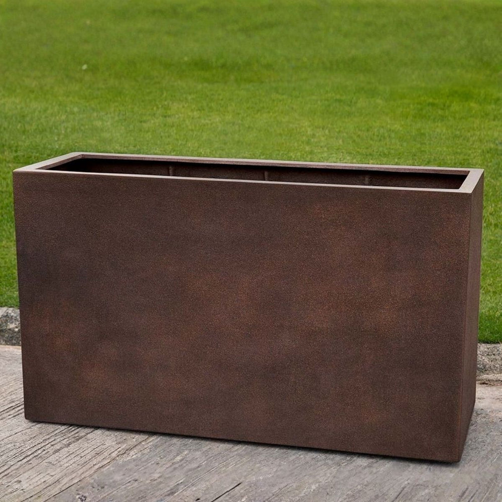 Sandal Planter 591836 S/1 in rust lite on concrete in the backyard.