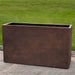 Sandal Planter 591836 S/1 in rust lite on concrete in the backyard.