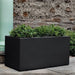Sandal Planter 592424 S/1 in onyx black lite on concrete filled with plants.