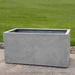 Sandal Planter 592424 S/1 in stone grey lite on concrete in the backyard.