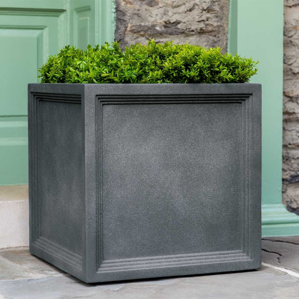 Sandhurst Square Planter, Medium on concrete filled with plants