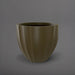 Santa Barbara Fluted Round Fiberglass Planter in matte bronze against gray background.