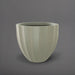 Santa Barbara Fluted Round Fiberglass Planter in satin beige against gray background.