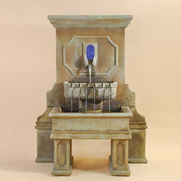 Savonna Wall Fountain with legs against brown background.