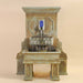 Savonna Wall Fountain with legs against brown background.