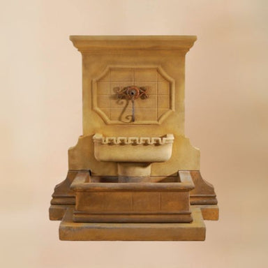 Savonna Wall Fountain with Step for Spout against brown background.
