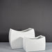 Seoul Modern Curved Rectangle Fiberglass Planter on concrete shown with two different sizes.