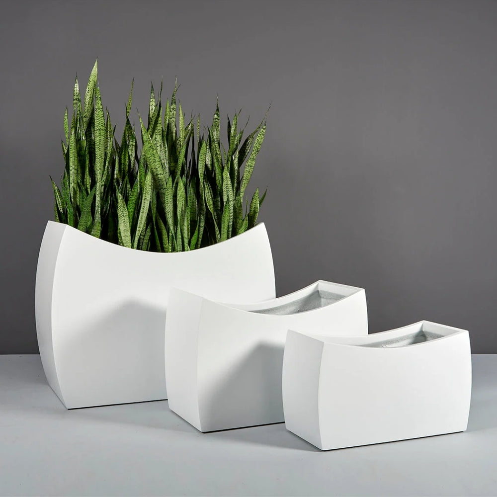 Seoul Modern Curved Rectangle Fiberglass Planter shown with three different sizes.