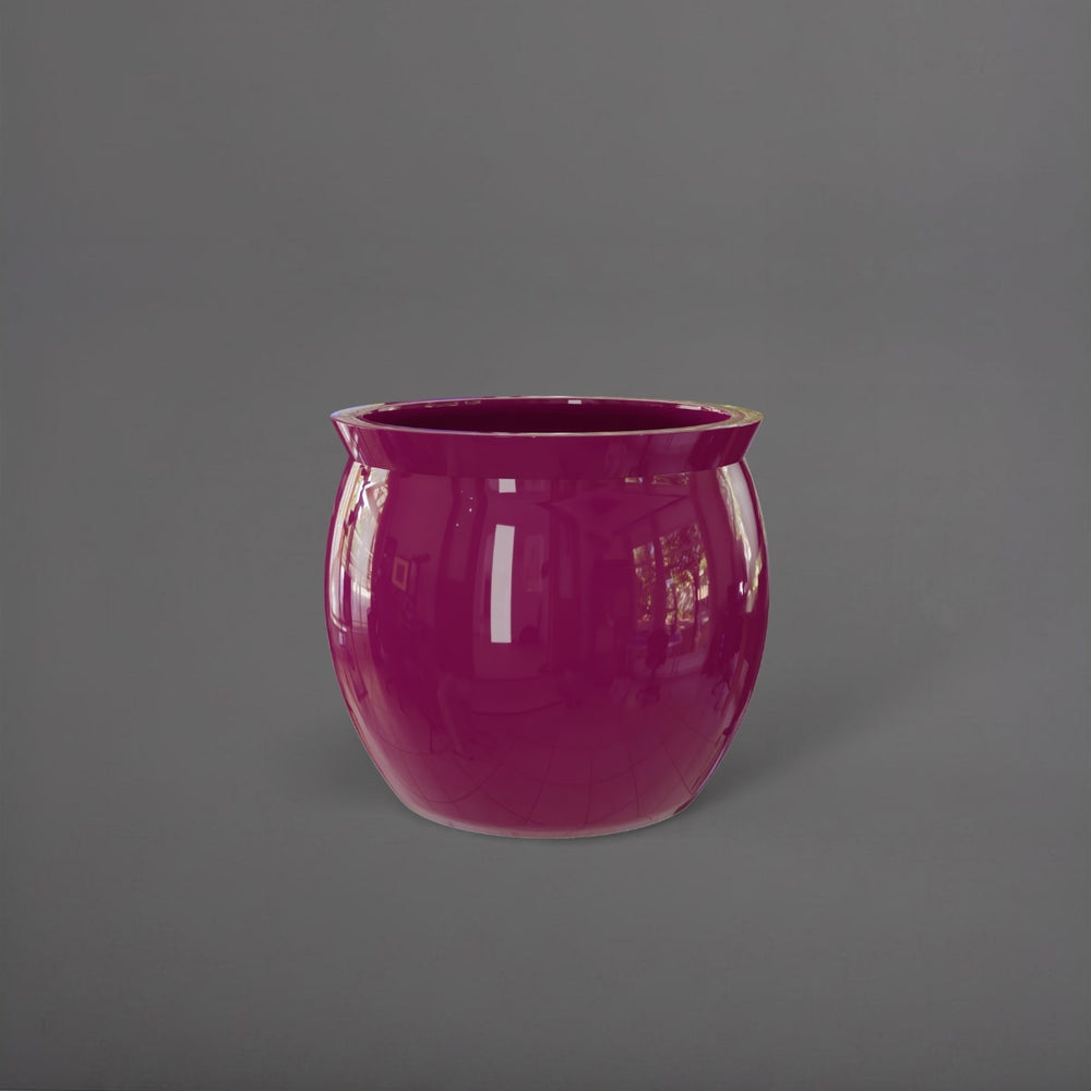 Shanghai Fishbowl Fiberglass Planter in gloss eggplant against gray background.