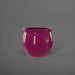 Shanghai Fishbowl Fiberglass Planter in gloss eggplant against gray background.