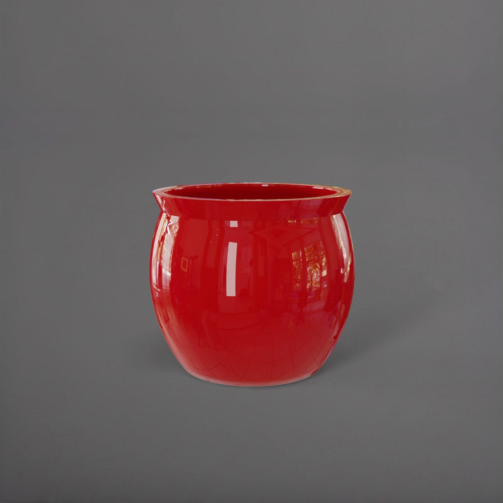 Shanghai Fishbowl Fiberglass Planter in gloss red against gray background.