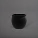 Shanghai Fishbowl Fiberglass Planter in matte black against gray background.