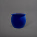 Shanghai Fishbowl Fiberglass Planter in matte cobalt blue against gray background.
