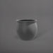 Shanghai Fishbowl Fiberglass Planter in matte gunmetal against gray background.