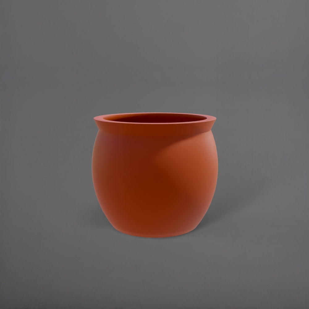 Shanghai Fishbowl Fiberglass Planter in matte terra cotta against gray background.