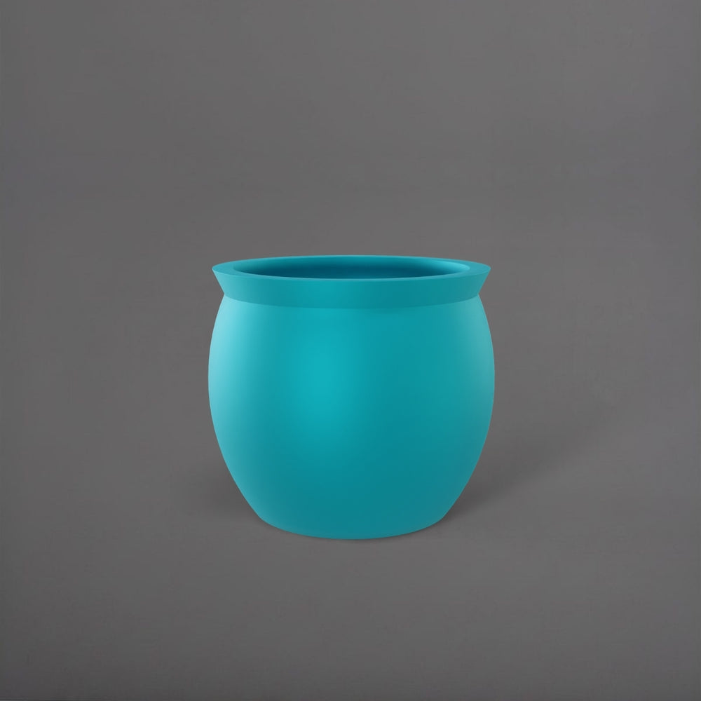 Shanghai Fishbowl Fiberglass Planter in satin seafoam green against gray background.