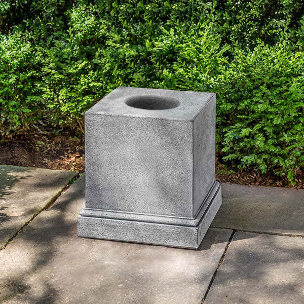 Shelbourne Pedestal on concrete against green leaves