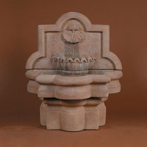 Shell Quatrefoil Wall Fountain, Small running against brown background