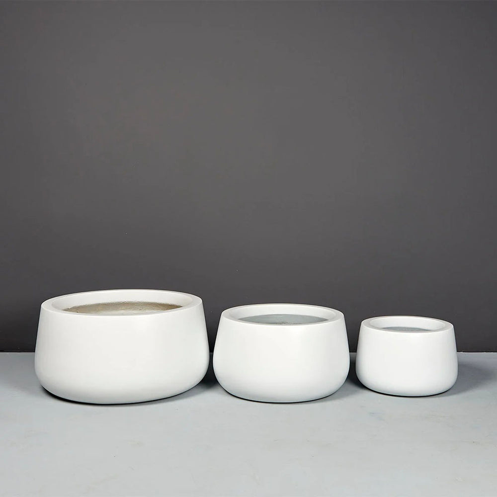 Short Hayden Tapered Round Fiberglass Planter in 3 different sizes on concrete 