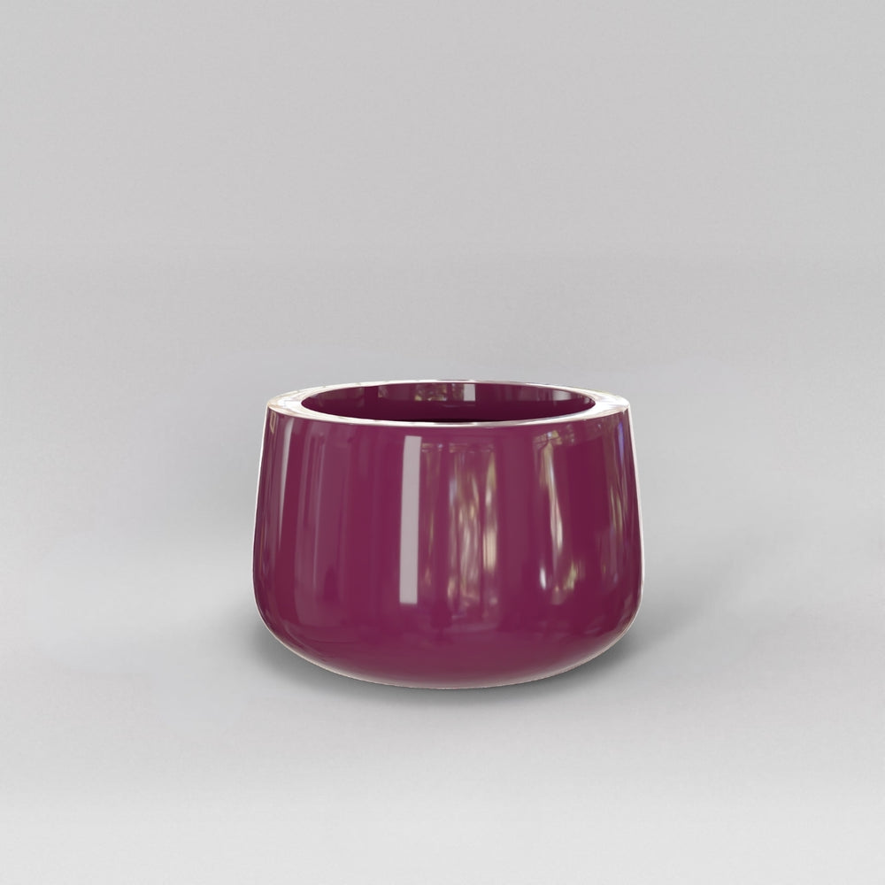 Short Hayden Tapered Round Fiberglass Planter in gloss eggplant against gray background.