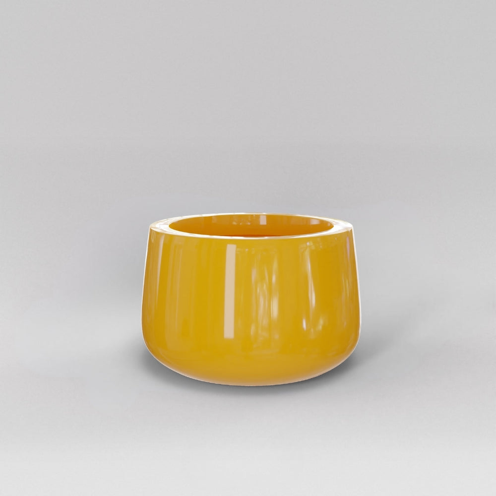 Short Hayden Tapered Round Fiberglass Planter in gloss saffron against gray background.