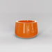 Short Hayden Tapered Round Fiberglass Planter in gloss tangerine against gray background.