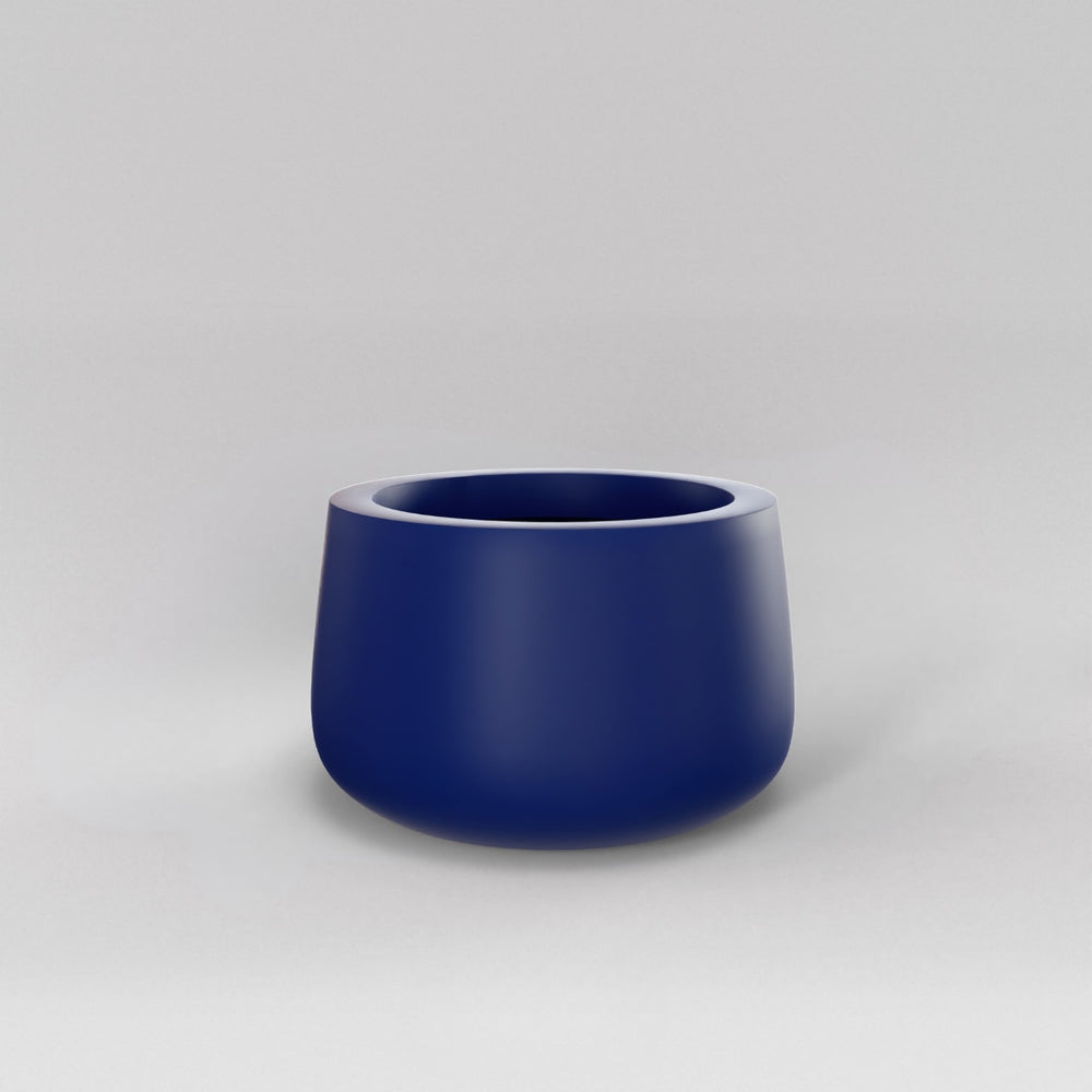 Short Hayden Tapered Round Fiberglass Planter in matte cobalt blue against gray background.