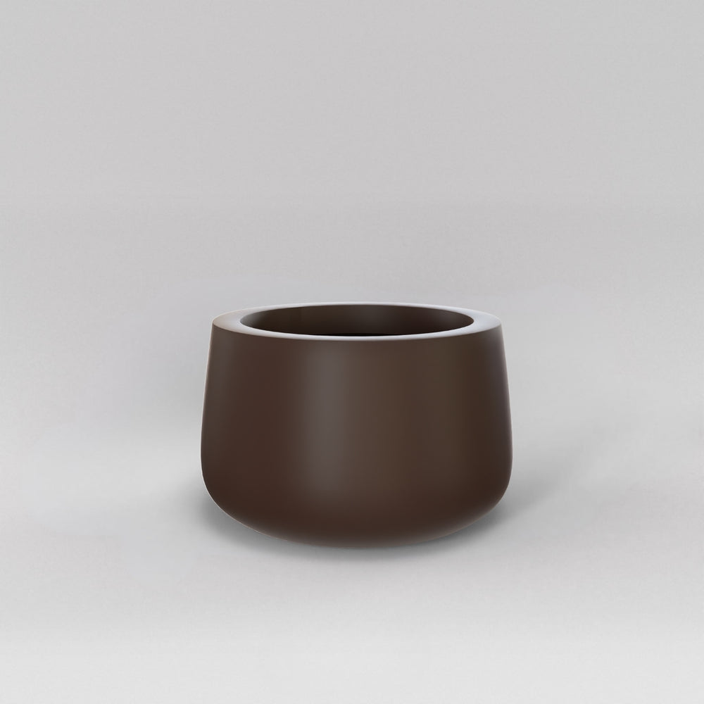 Short Hayden Tapered Round Fiberglass Planter in matte dark brown against gray background.