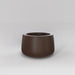 Short Hayden Tapered Round Fiberglass Planter in matte dark brown against gray background.