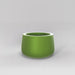 Short Hayden Tapered Round Fiberglass Planter in satin green against gray background.