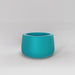 Short Hayden Tapered Round Fiberglass Planter in satin seafoam green against gray background.
