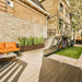 Siena Low Rectangle Wood Look Fiberglass Planter filled with plants in the balcony.