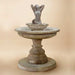 Sirena Mermaid Fountain against brown background.