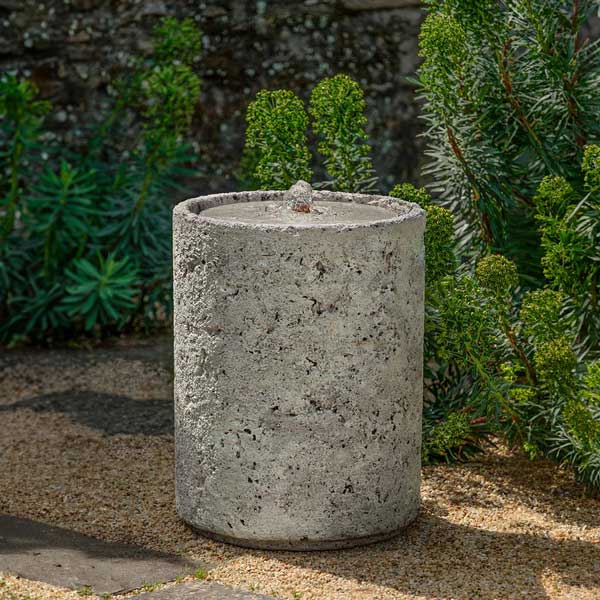 Siros Fountain on the ground with plants background