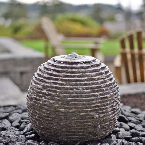 Small Ribbed Sphere Granite Fountain Kit on black peebles in action