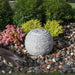 Small Ribbed Sphere Granite Fountain Kit on mixed peebles in action