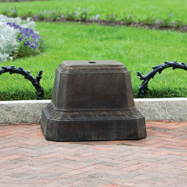 Smithsonian Egg and Dart Pedestal on concrete in the backyard