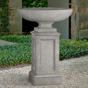 Somerset Urn with Estate Pedestal on gravel in the backyard