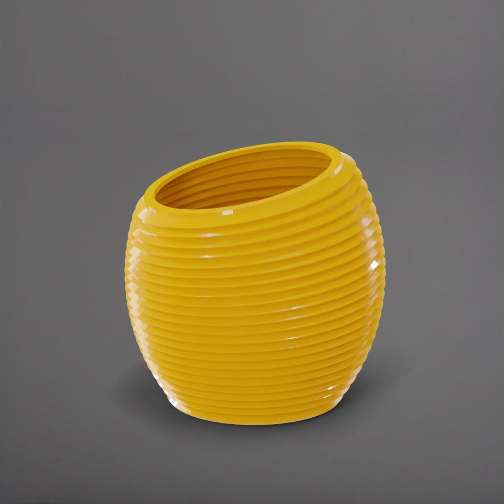 Spiral Globe Fiberglass Planter in gloss saffron against gray background.