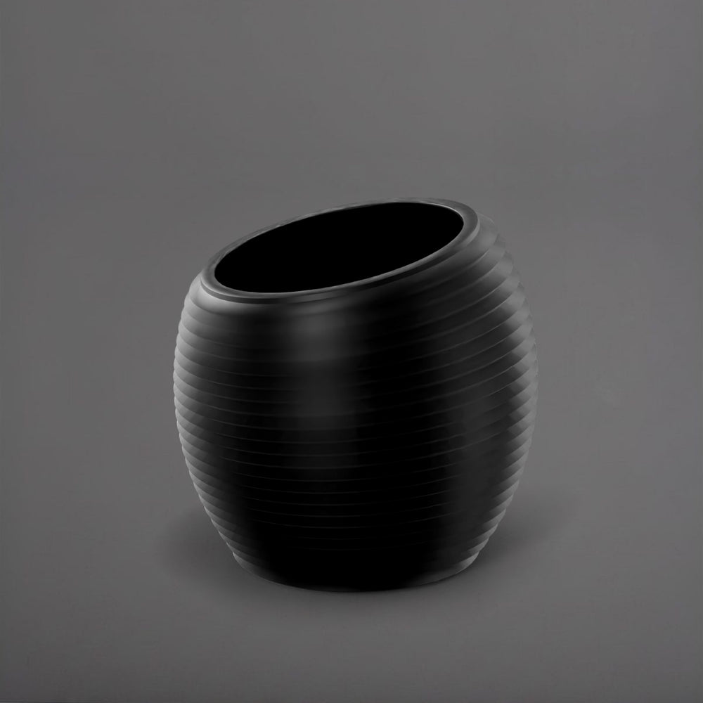 Spiral Globe Fiberglass Planter in matte black against gray background.