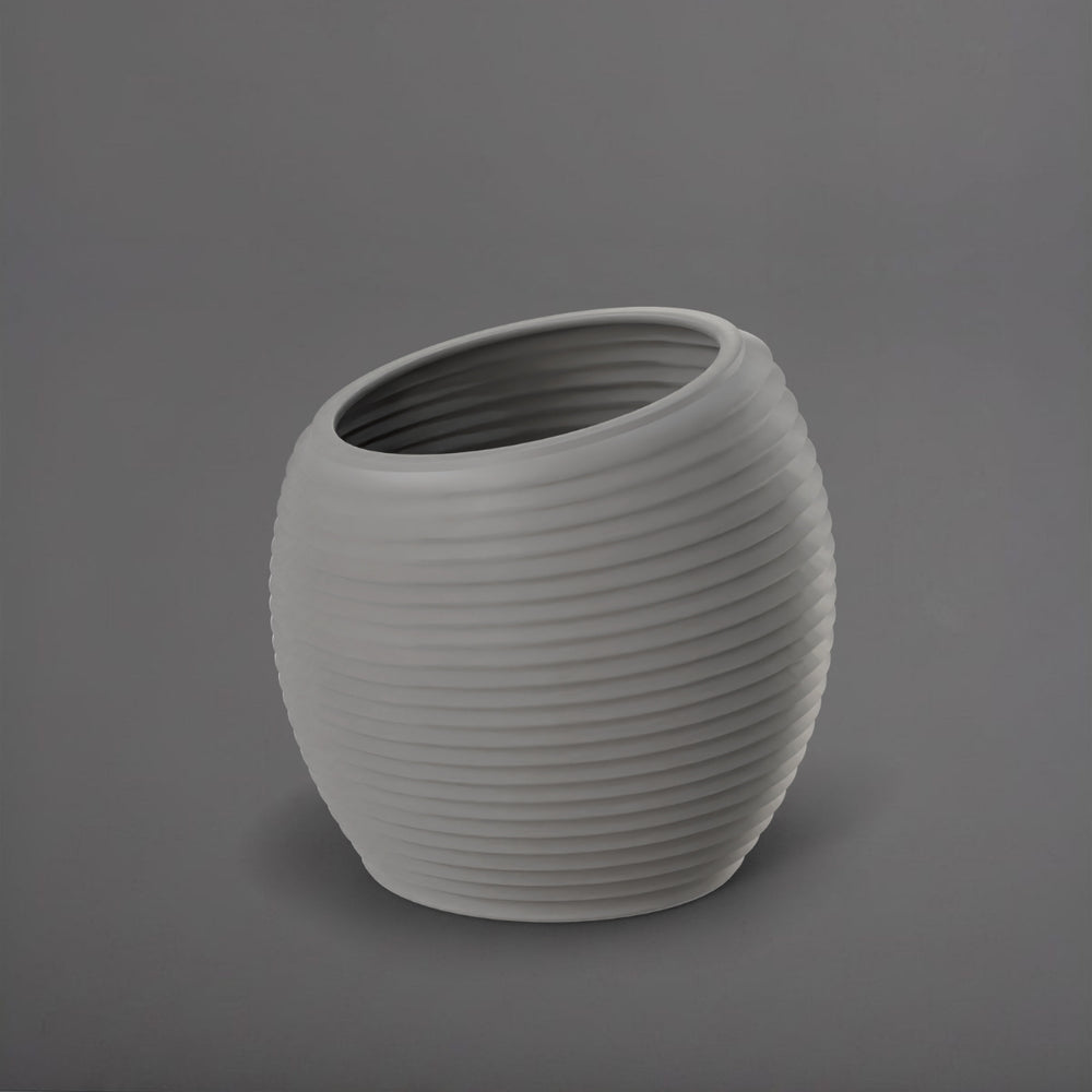 Spiral Globe Fiberglass Planter in matte cement grey against gray background.