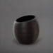 Spiral Globe Fiberglass Planter in matte charcoal against gray background.