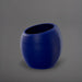 Spiral Globe Fiberglass Planter in matte cobalt blue against gray background.