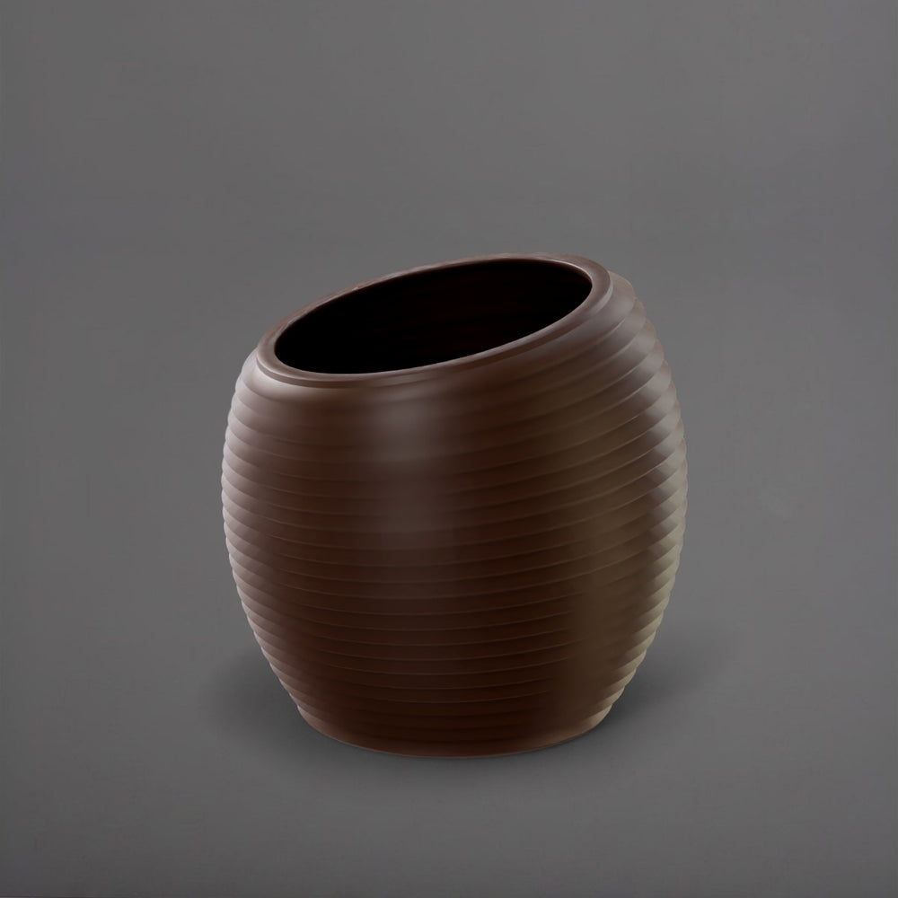 Spiral Globe Fiberglass Planter in matte dark brown against gray background.